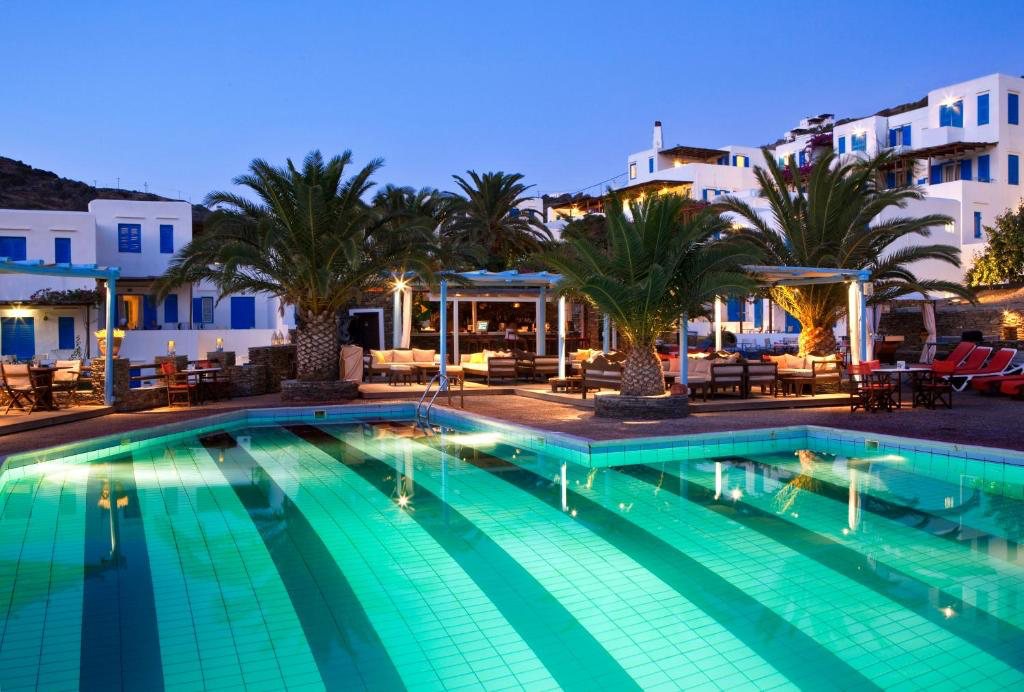 The pool and lounge terrace at Hotel Alexandros at dusk
